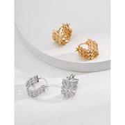 Gold filigree hoop earrings with intricate design, ideal for jewelry storage, jewelry websites, vintage jewelry collections, and sophisticated fashion looks.