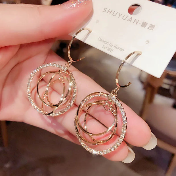 Double hoop earrings with sparkling crystals, perfect for jewelry cleaning, jewelry storage, and featuring on jewelry websites for diamond and jewelry lovers.