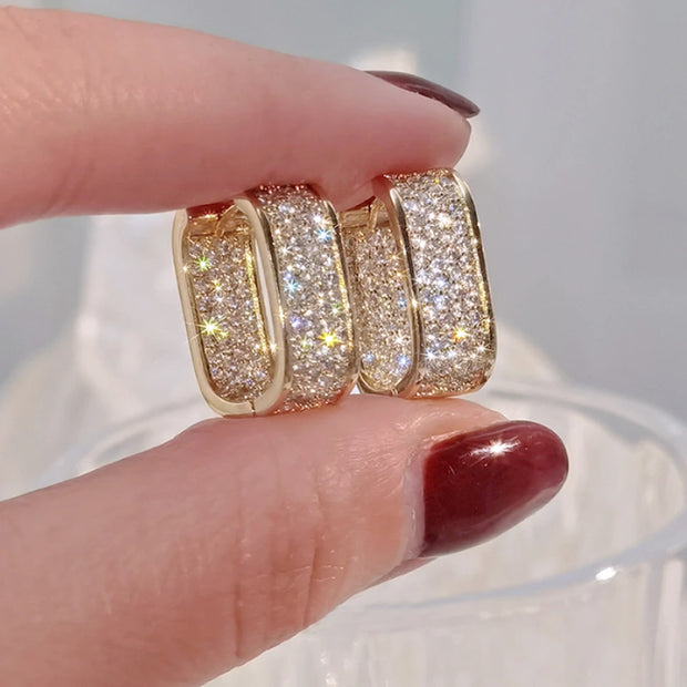Luxury gold diamond hoop earrings for earrings piercing, jewelry storage, jewelry websites, and gifting. Perfect for diamond and jewelry lovers and elegant styles.