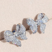 Dazzling bow-shaped stud earrings with crystals, perfect for jewelry storage, jewelry websites, vintage jewelry collections, and as gifts for jewelry lovers.