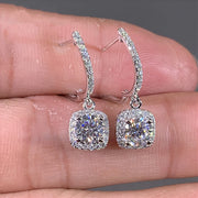 Luxury diamond drop earrings in silver, ideal for jewelry designers and collectors, suitable for elegant occasions, featured on jewelry websites and jewelry storage collections.