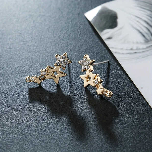 Gold star cluster earrings with sparkling crystals, ideal for jewelry websites, jewelry storage, diamond and jewelry lovers, and gifting for mom or special occasions.