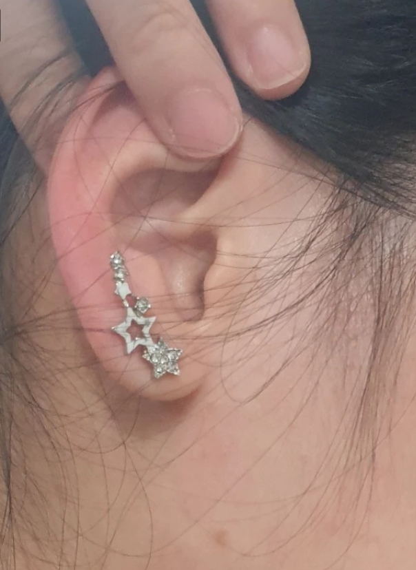 Gold star cluster earrings with sparkling crystals, ideal for jewelry websites, jewelry storage, diamond and jewelry lovers, and gifting for mom or special occasions.