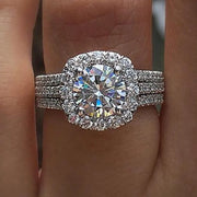 Stunning diamond engagement ring with halo setting and triple diamond bands, perfect for jewelry websites, jewelry storage, vintage jewelry, and proposals.