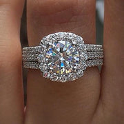 Stunning diamond engagement ring with halo setting and triple diamond bands, perfect for jewelry websites, jewelry storage, vintage jewelry, and proposals.