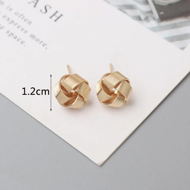 Gold knot earrings designed by jewelry designers, ideal for earrings piercing and vintage jewelry lovers, perfect for jewelry storage or as a gift in a jewelry case.