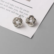 Gold knot earrings designed by jewelry designers, ideal for earrings piercing and vintage jewelry lovers, perfect for jewelry storage or as a gift in a jewelry case.