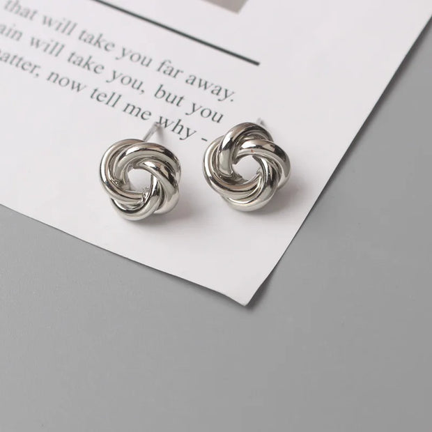 Gold knot earrings designed by jewelry designers, ideal for earrings piercing and vintage jewelry lovers, perfect for jewelry storage or as a gift in a jewelry case.