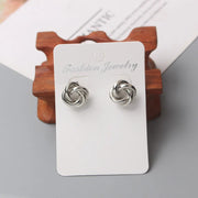 Gold knot earrings designed by jewelry designers, ideal for earrings piercing and vintage jewelry lovers, perfect for jewelry storage or as a gift in a jewelry case.