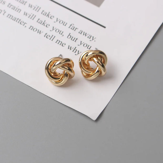 Gold knot earrings designed by jewelry designers, ideal for earrings piercing and vintage jewelry lovers, perfect for jewelry storage or as a gift in a jewelry case.