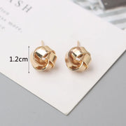 Gold knot earrings designed by jewelry designers, ideal for earrings piercing and vintage jewelry lovers, perfect for jewelry storage or as a gift in a jewelry case.