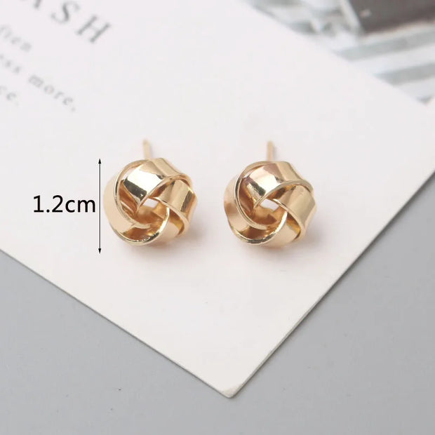 Gold knot earrings designed by jewelry designers, ideal for earrings piercing and vintage jewelry lovers, perfect for jewelry storage or as a gift in a jewelry case.