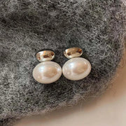 Elegant silver and pearl stud earrings, ideal for jewelry websites, jewelry storage, vintage jewelry, earrings piercing, and gifting for mom or jewelry lovers.